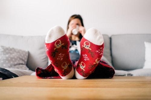 Relaxed woman sitting with feet up