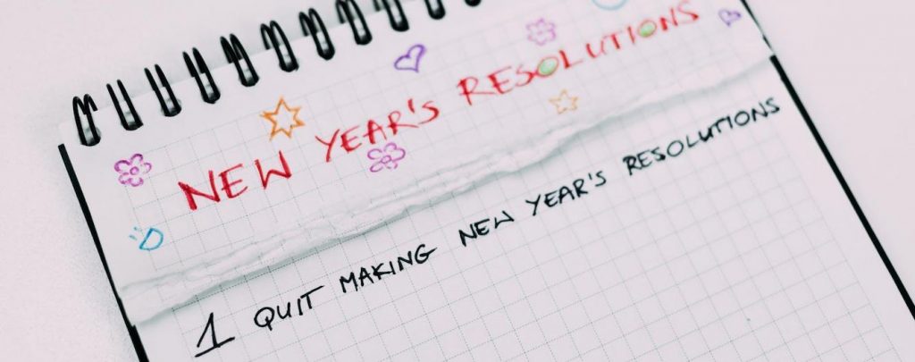 notebook details new year resolutions with subheading 1 quit making new year resolutions