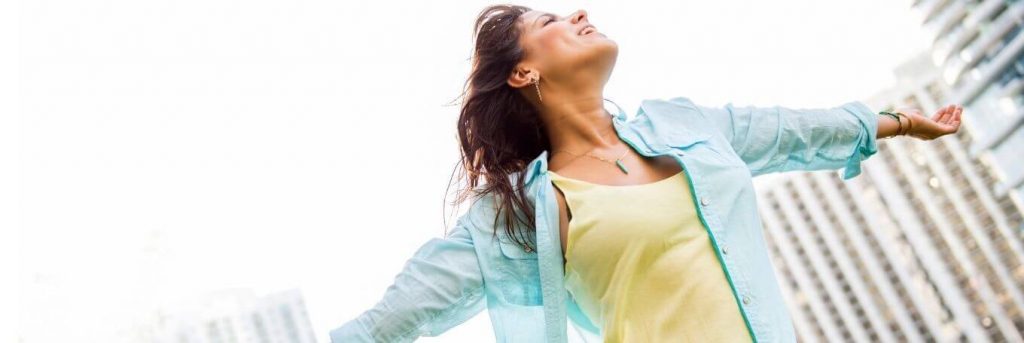 woman gratitude life tall modern buildings