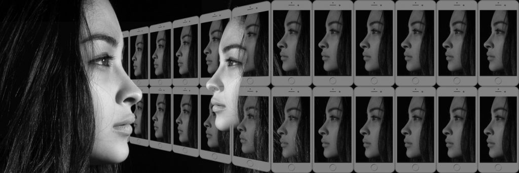 woman serious face reflected on iphone screens