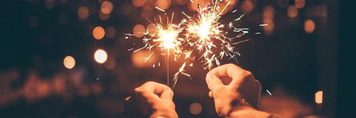 hands holding lighting sticks