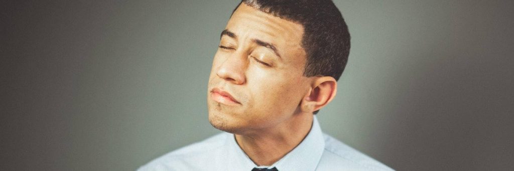 man closes eyes