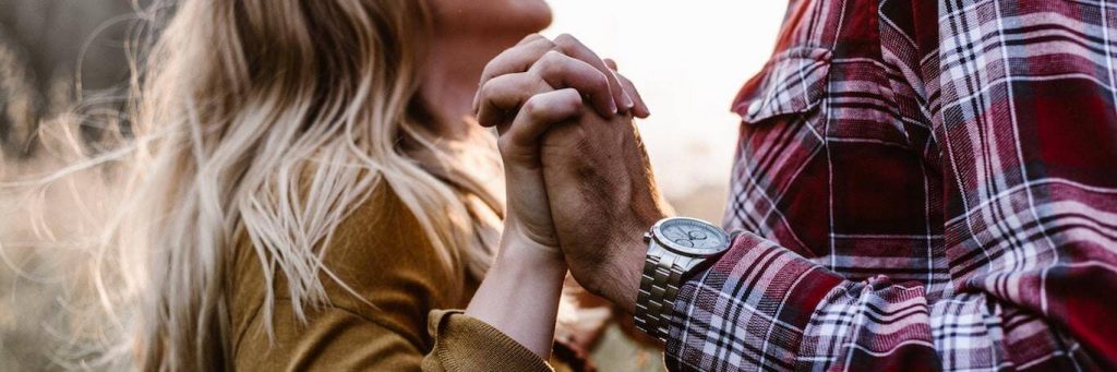 couple holds hands