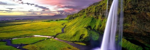 breathtaking scene waterfall mountain green field in dark cloudy sky