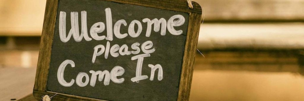 black board signaling welcome please come in