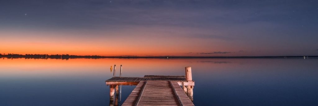 sea cliff blue ocean in peaceful sunset view