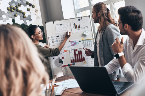 Innovative, creative woman explaining ideas to her team
