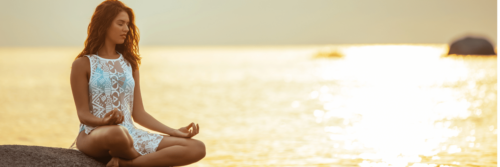 Woman meditating in Golden Light