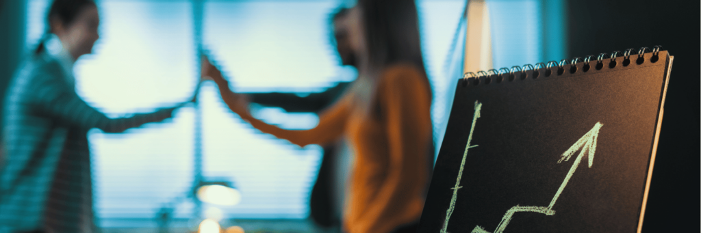 Business people high fiving and celebrating their success